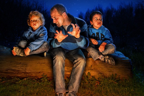 dad and two kids in forest 