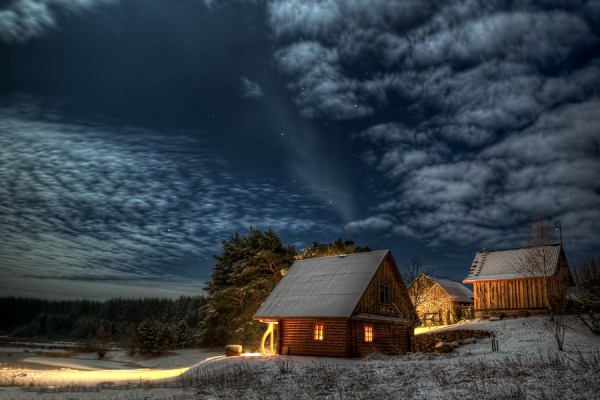 Night sky over a two shacks