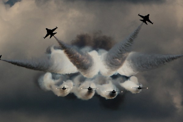 fighter jets flying in different directions