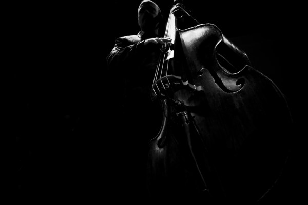 Unusual angle of man playing cello