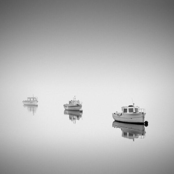 Black and white photo of three boats