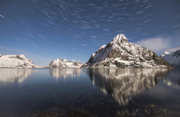 Starry night photography with reflection of mountains 
