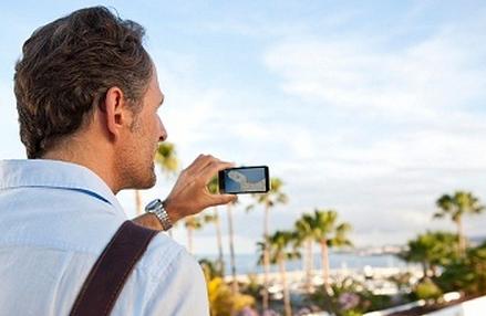 man holding a cell phone camera
