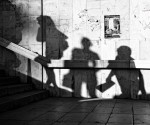 a street photograph with shadows of people -- street photography tips